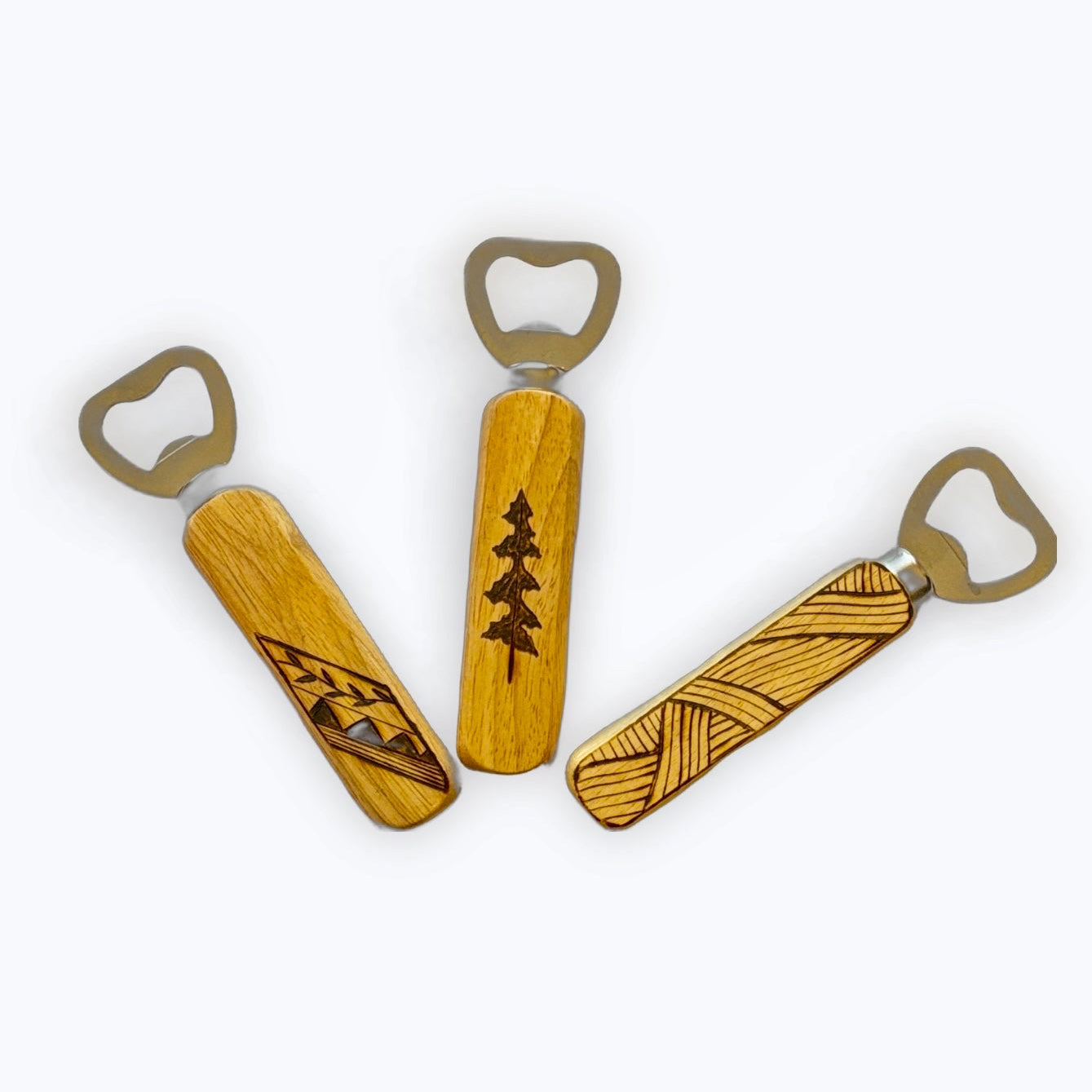 Three wooden bottle openers with engraved designs on a white background