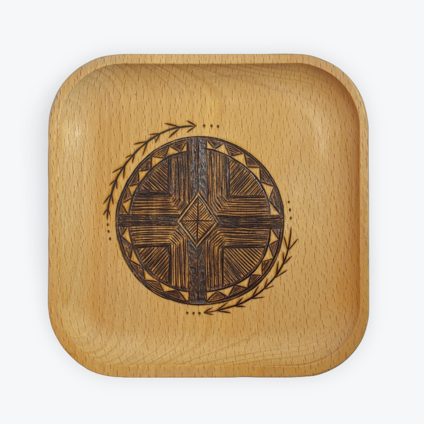 Wooden square trinket tray with engraved design on a white background