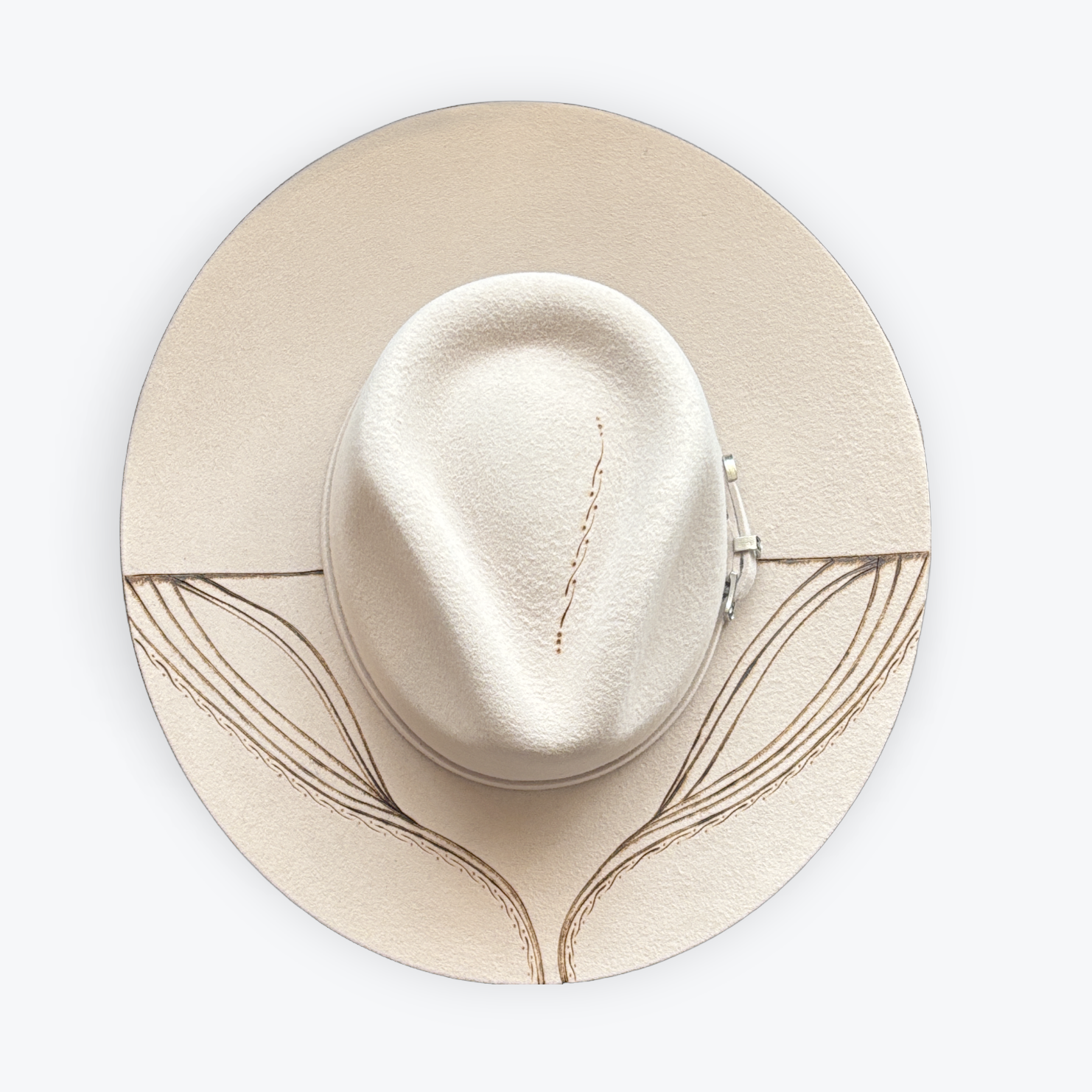 Beige hat with a decorative band on a white background