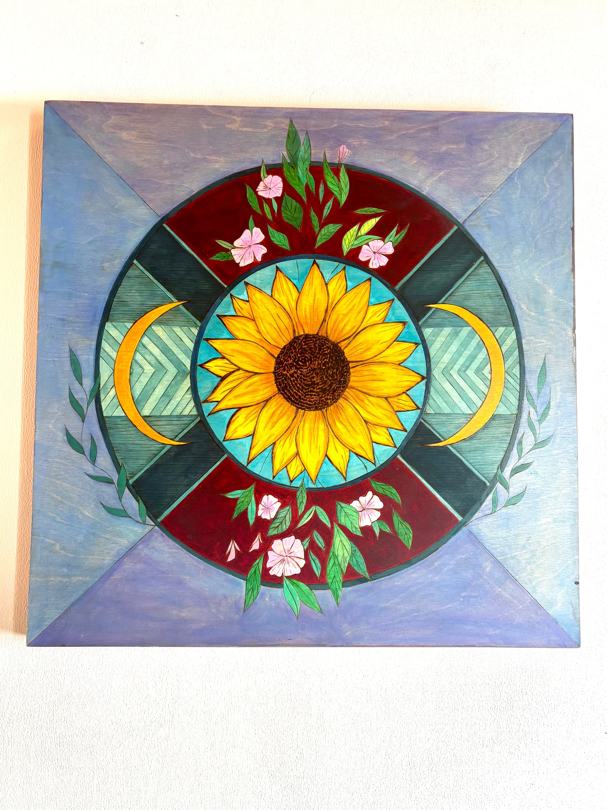 Decorative panel with a sunflower design on a wooden background