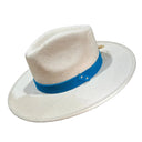 A white felt wide-brim hat with a bright blue band and silver snap details, shown against a solid white background.