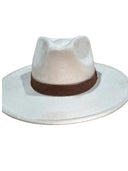 A light beige felt fedora hat with a brown suede band, photographed against a solid black background.